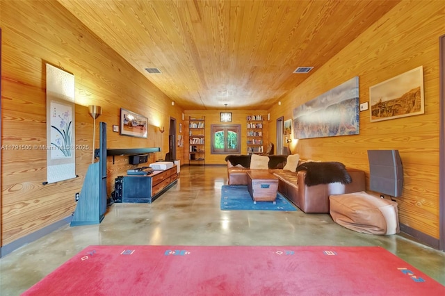 living room featuring visible vents, wood walls, wooden ceiling, and finished concrete floors