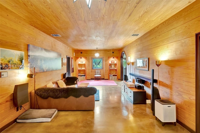 living room featuring arched walkways, wood walls, concrete floors, visible vents, and wood ceiling
