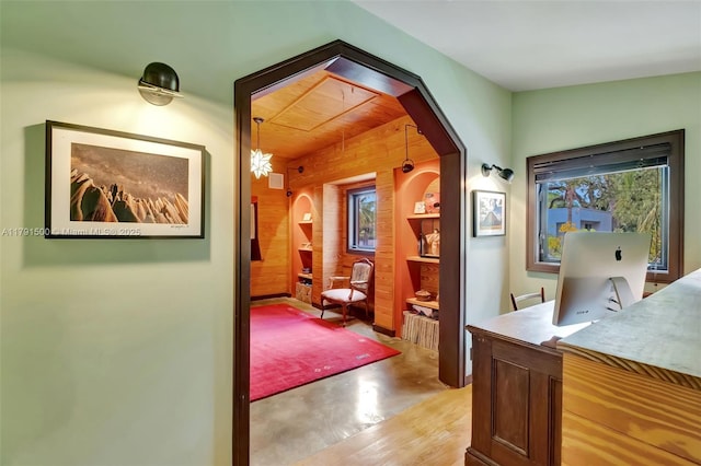 2760 Kirk St, Coconut Grove, FL 33133 - office with wooden walls, arched walkways, and concrete flooring