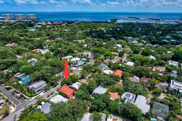 birds eye view of property with a water view and a residential view