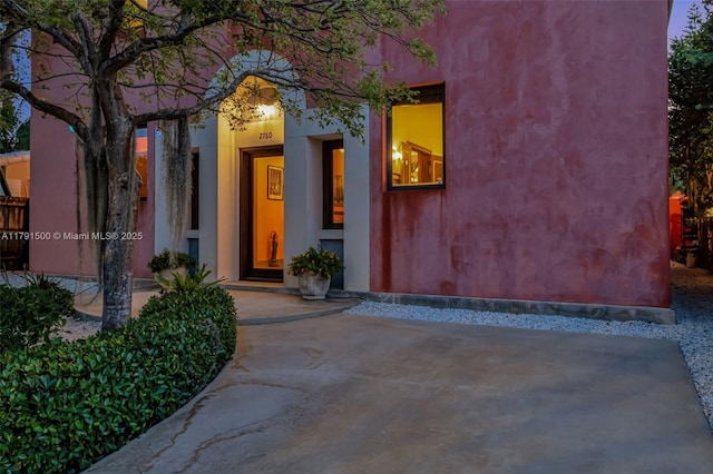 2760 Kirk St, Coconut Grove, FL 33133 - property entrance featuring covered porch and stucco siding