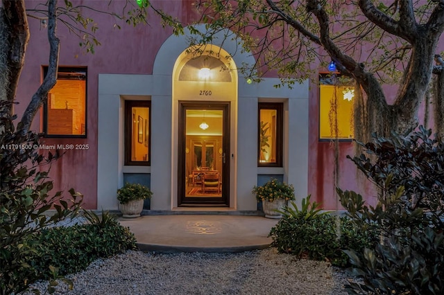 2760 Kirk St, Coconut Grove, FL 33133 - view of exterior entry featuring a porch and stucco siding