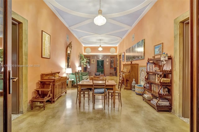 2760 Kirk St, Coconut Grove, FL 33133 - dining area with finished concrete floors, coffered ceiling, beam ceiling, and an inviting chandelier