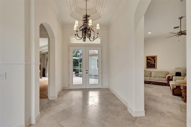 4 Mccairn Ct, Palm Beach Gardens, FL 33418 - entrance foyer featuring crown molding, arched walkways, baseboards, and french doors