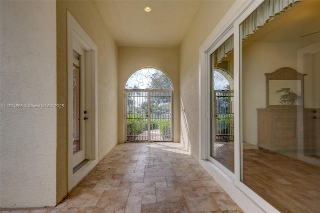 4 Mccairn Ct, Palm Beach Gardens, FL 33418 - exterior space featuring a textured wall and stone tile flooring