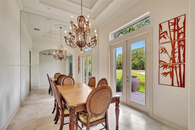 4 Mccairn Ct, Palm Beach Gardens, FL 33418 - dining space with crown molding, visible vents, a raised ceiling, french doors, and a notable chandelier