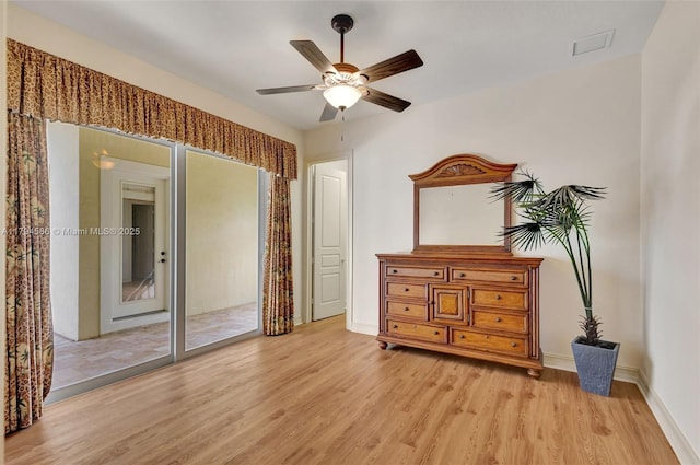 4 Mccairn Ct, Palm Beach Gardens, FL 33418 - bedroom featuring a ceiling fan, baseboards, and light wood-type flooring