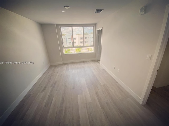 2505 NE 193rd St Unit 4204, Aventura, FL 33180 - empty room featuring baseboards, wood finished floors, and visible vents