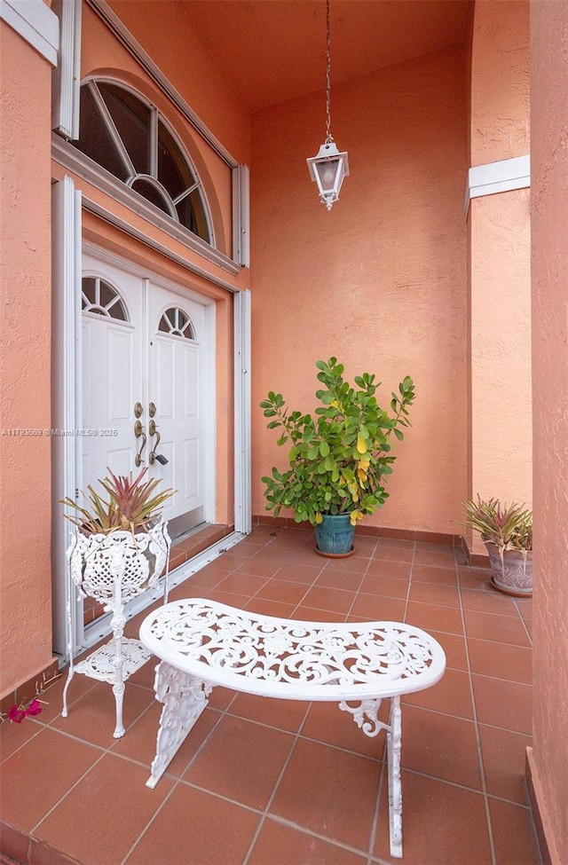 13230 NW 10th St, Miami, FL 33182 - doorway to property with a porch and stucco siding
