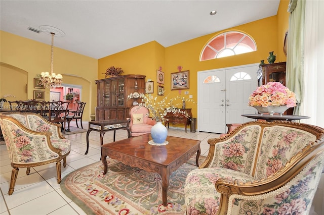 13230 NW 10th St, Miami, FL 33182 - living room with visible vents, a high ceiling, a chandelier, arched walkways, and light tile patterned floors