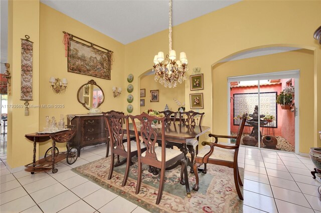 13230 NW 10th St, Miami, FL 33182 - dining space with baseboards, arched walkways, light tile patterned floors, and a chandelier