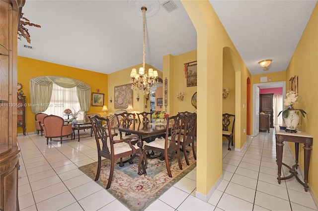13230 NW 10th St, Miami, FL 33182 - dining area with arched walkways, a notable chandelier, visible vents, and light tile patterned floors