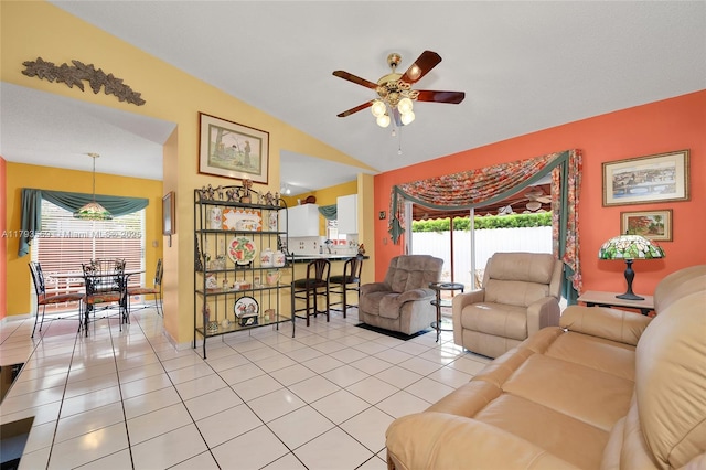 13230 NW 10th St, Miami, FL 33182 - living area featuring a ceiling fan, a wealth of natural light, light tile patterned floors, and lofted ceiling