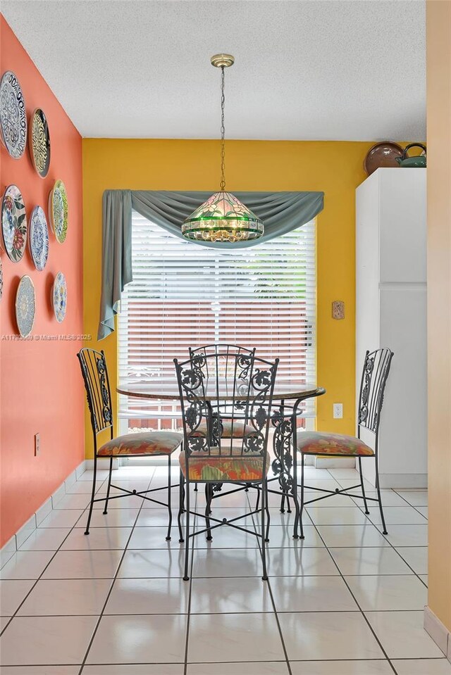 13230 NW 10th St, Miami, FL 33182 - dining space featuring light tile patterned flooring and a textured ceiling