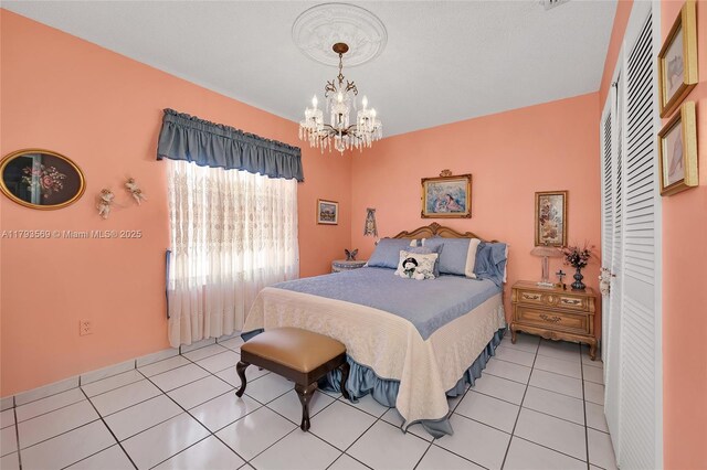 13230 NW 10th St, Miami, FL 33182 - bedroom with an inviting chandelier and light tile patterned floors