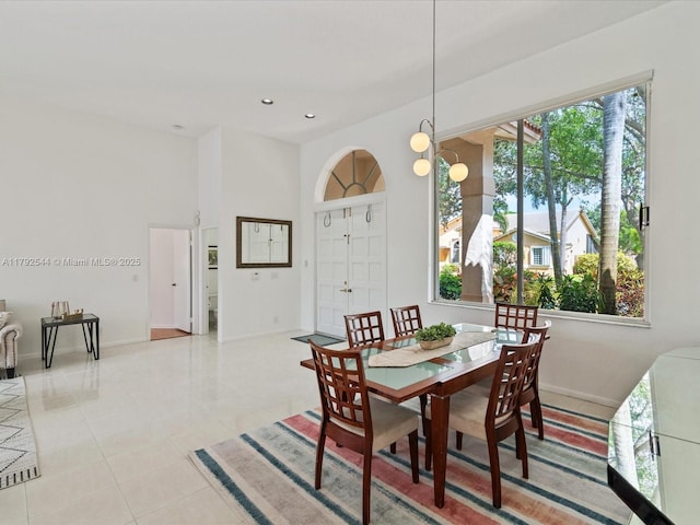 1230 SW 102nd Ave, Pembroke Pines, FL 33025 - dining area with light tile patterned floors, baseboards, and plenty of natural light