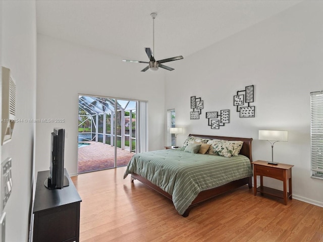 1230 SW 102nd Ave, Pembroke Pines, FL 33025 - bedroom with access to outside, a high ceiling, ceiling fan, light wood-style floors, and baseboards