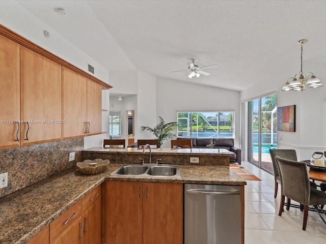 1230 SW 102nd Ave, Pembroke Pines, FL 33025 - kitchen with a sink, a peninsula, open floor plan, lofted ceiling, and stainless steel dishwasher