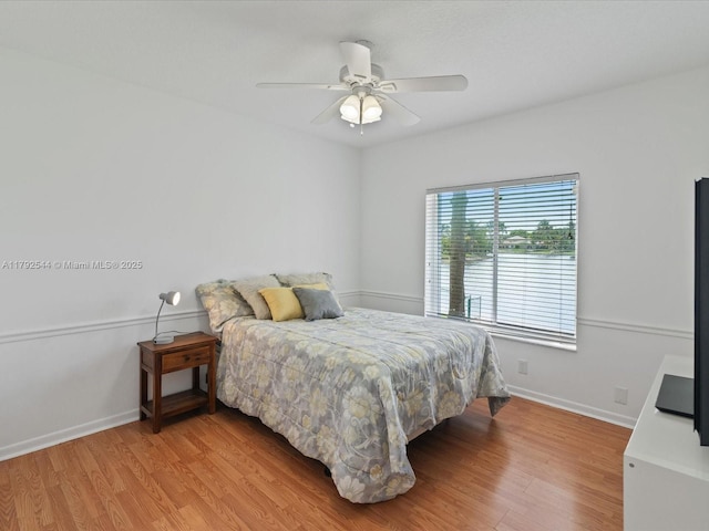 1230 SW 102nd Ave, Pembroke Pines, FL 33025 - bedroom featuring baseboards, ceiling fan, and light wood-style flooring