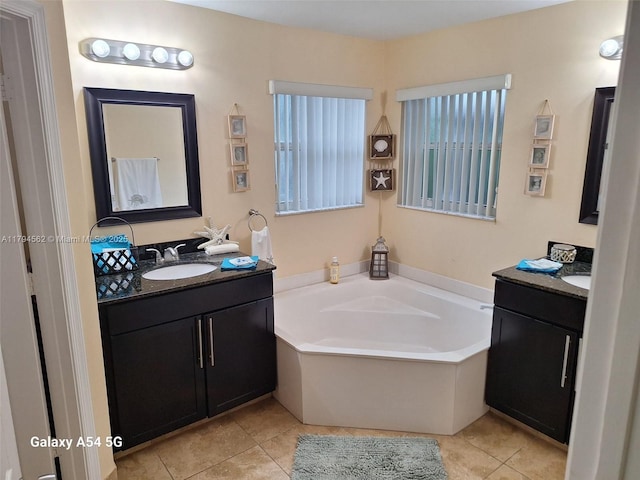 20401 SW 1st St, Pembroke Pines, FL 33029 - full bathroom featuring tile patterned floors, two vanities, a sink, and a garden tub