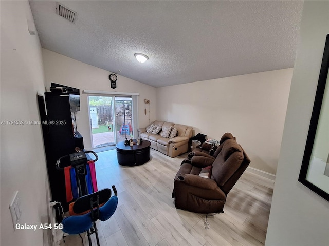 20401 SW 1st St, Pembroke Pines, FL 33029 - living room with a textured ceiling, visible vents, and wood finished floors