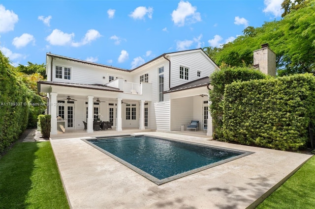 730 Santurce Ave, Coral Gables, FL 33143 - back of property featuring a porch and a chimney