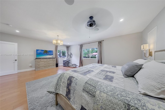 bedroom featuring recessed lighting, baseboards, and wood finished floors