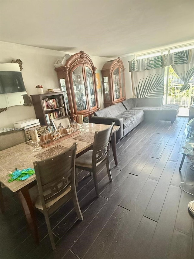 dining area with dark wood finished floors