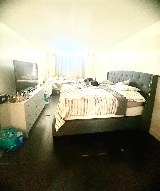 bedroom featuring dark wood-type flooring