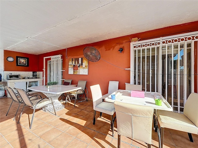dining room with tile patterned floors