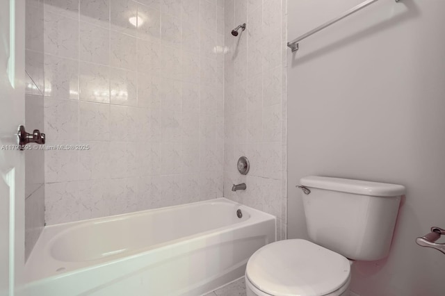 bathroom with bathing tub / shower combination and toilet