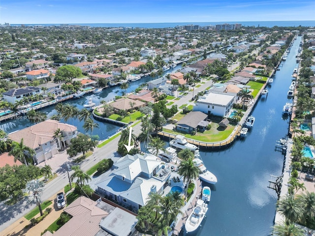 birds eye view of property with a water view and a residential view