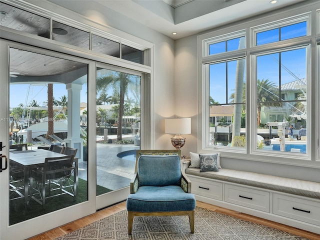 living area with light wood-type flooring, recessed lighting, and a wealth of natural light