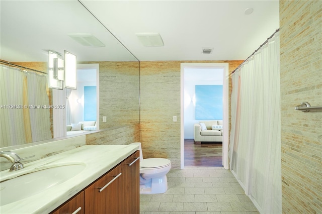 50 Biscayne Blvd Unit 602, Miami, FL 33132 - bathroom with vanity, tile patterned floors, curtained shower, and tile walls