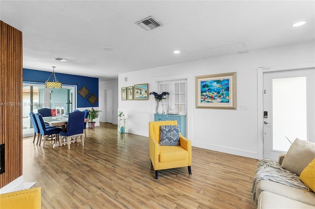 6690 Miramar Pkwy, Miramar, FL 33023 - living room featuring light wood-style floors and recessed lighting