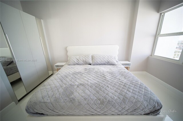 bedroom featuring baseboards