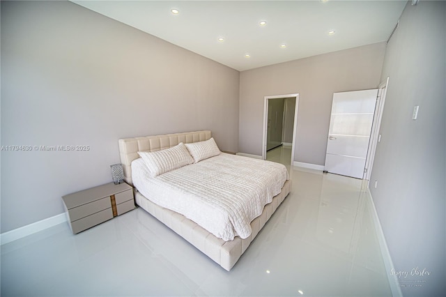 bedroom featuring baseboards and recessed lighting