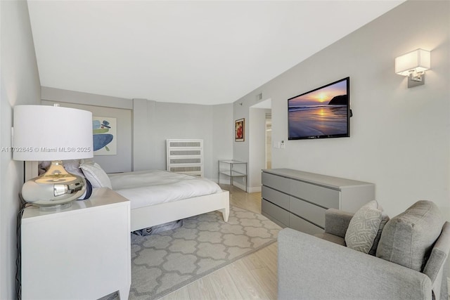 bedroom with wood finished floors