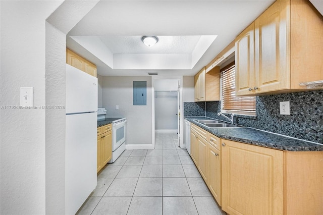 2821 N 74th Ave, Hollywood, FL 33024 - kitchen with white appliances, light brown cabinetry, a tray ceiling, and a sink