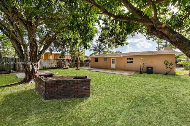 2821 N 74th Ave, Hollywood, FL 33024 - rear view of house with stucco siding and a patio