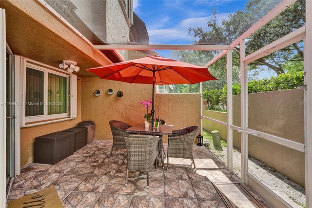 view of patio with fence and outdoor dining area