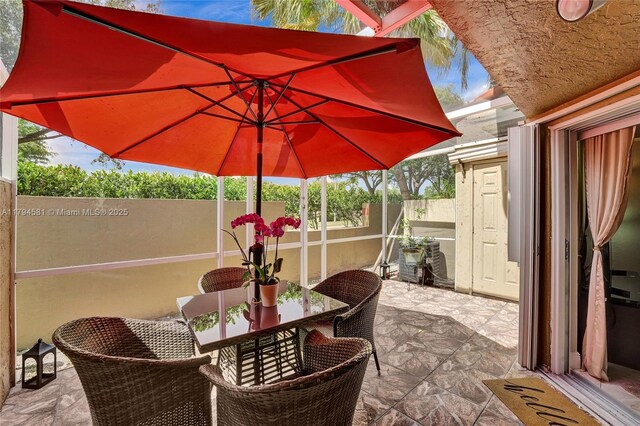 view of patio / terrace featuring fence and outdoor dining space