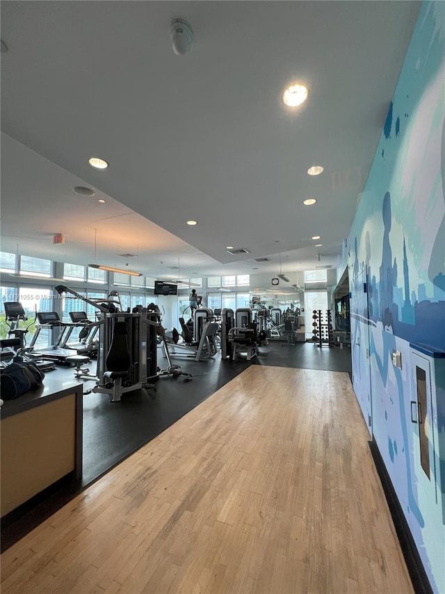 gym featuring recessed lighting and wood finished floors