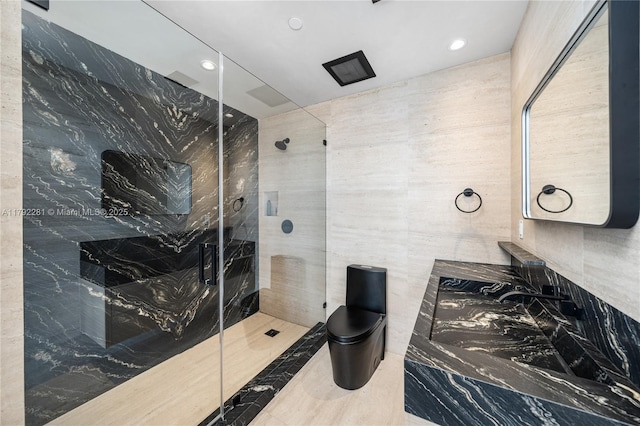 full bathroom with recessed lighting, toilet, tile walls, and a stall shower