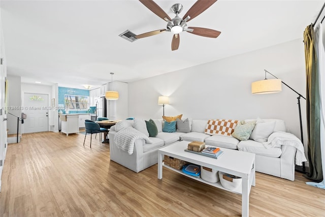 450 SE 7th St Unit 234, Dania Beach, FL 33004 - living room featuring visible vents, a ceiling fan, and light wood finished floors