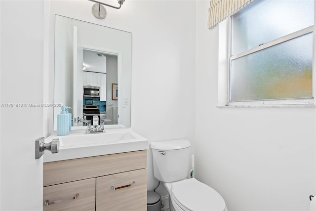 450 SE 7th St Unit 234, Dania Beach, FL 33004 - bathroom featuring vanity and toilet