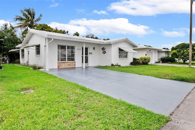 5810 NW 82nd Ter, Tamarac, FL 33321 - single story home with concrete driveway, a front lawn, and stucco siding