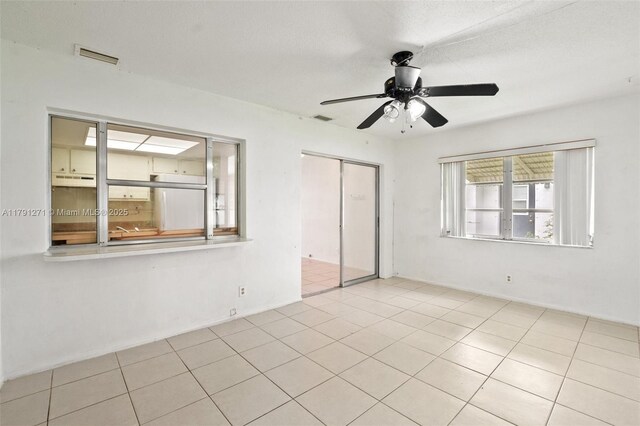5810 NW 82nd Ter, Tamarac, FL 33321 - tiled spare room with ceiling fan