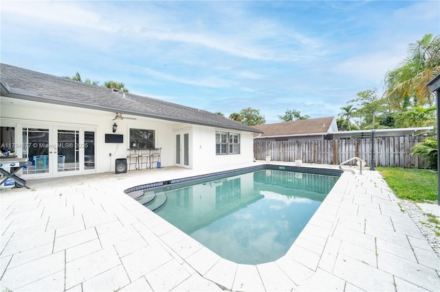 7354 NW 49th Ct, Lauderhill, FL 33319 - view of pool with fence, french doors, a patio area, and a fenced in pool
