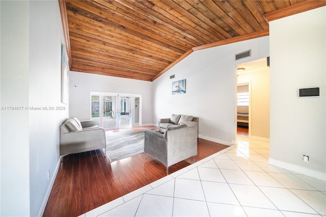 7354 NW 49th Ct, Lauderhill, FL 33319 - tiled living area with french doors, baseboards, vaulted ceiling, visible vents, and wood ceiling